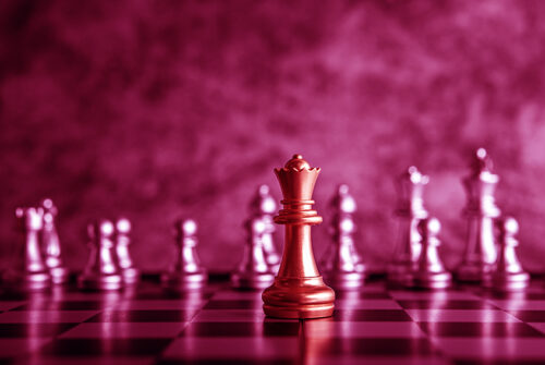 Gold and Silver Chess on chess board game for business metaphor leadership concept